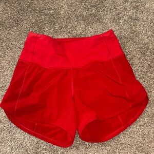 Red Lululemon speed up shorts. Size 0